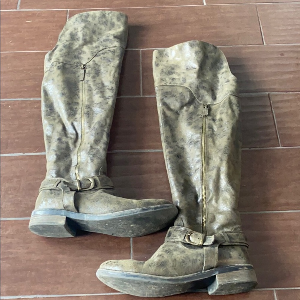 Distressed knee high boots